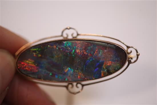 An Edwardian 9ct gold and black opal brooch, 51mm.